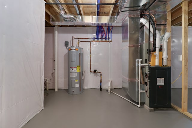 utility room featuring electric water heater