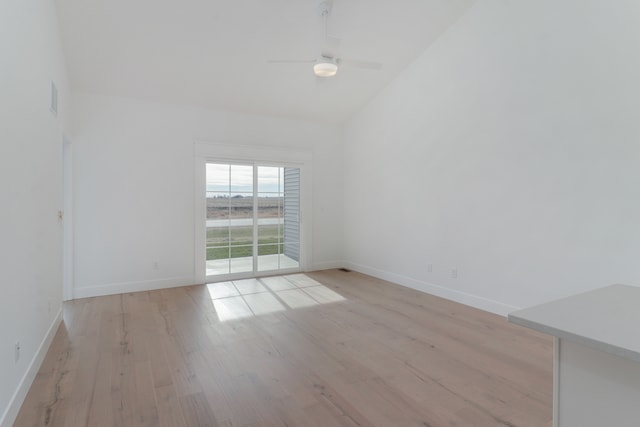 unfurnished room featuring lofted ceiling, light hardwood / wood-style flooring, and ceiling fan