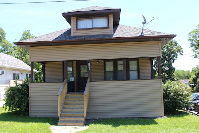 view of front of home featuring a front lawn and covered porch