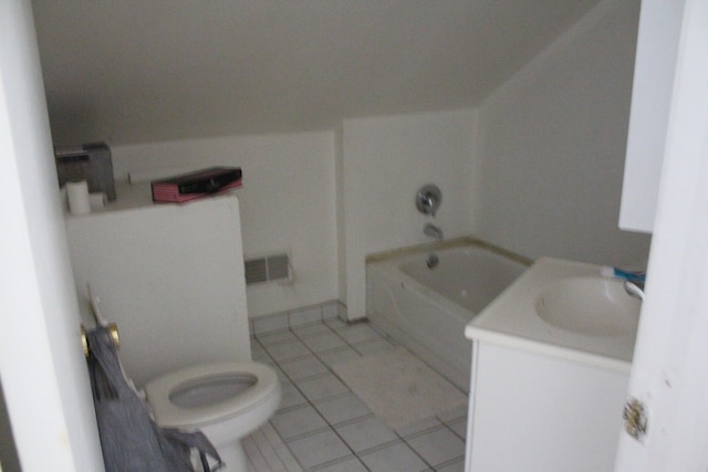 bathroom with tile patterned flooring, vanity, and toilet