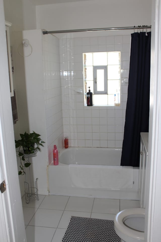 full bathroom with shower / bath combo, vanity, toilet, and tile patterned floors