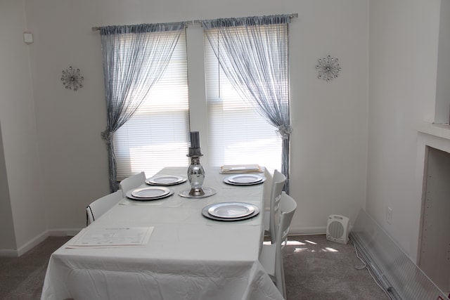 dining area with dark carpet