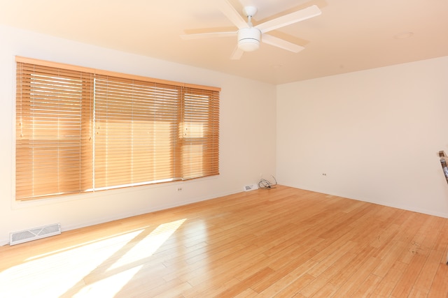 unfurnished room featuring light hardwood / wood-style floors and ceiling fan