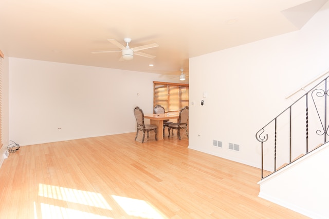 spare room with ceiling fan and light wood-type flooring