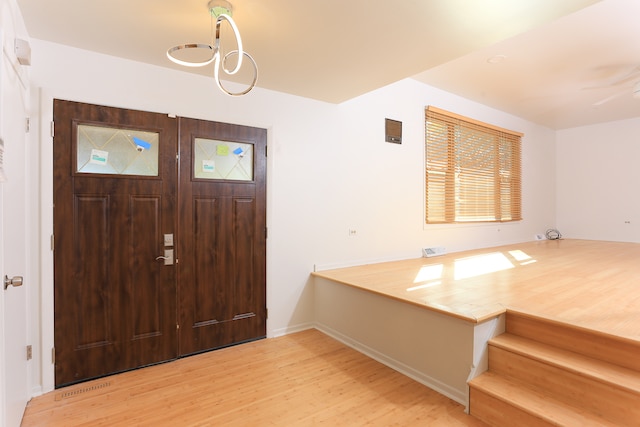 entrance foyer with hardwood / wood-style flooring and ceiling fan