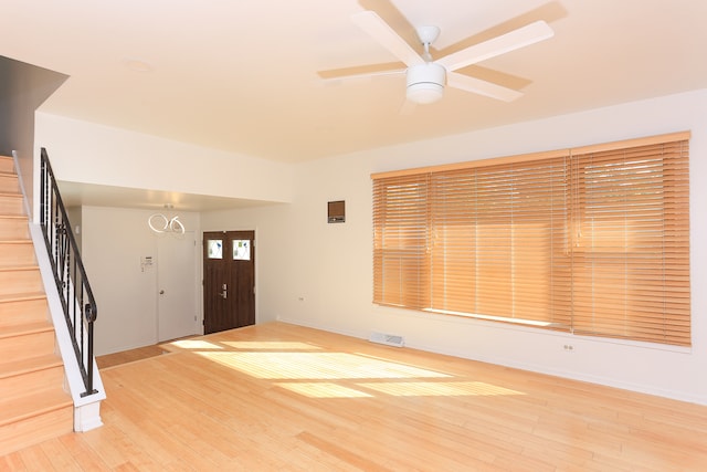 entrance foyer with ceiling fan and light wood-type flooring