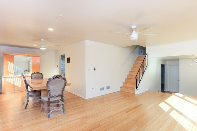 dining space featuring light hardwood / wood-style floors and ceiling fan