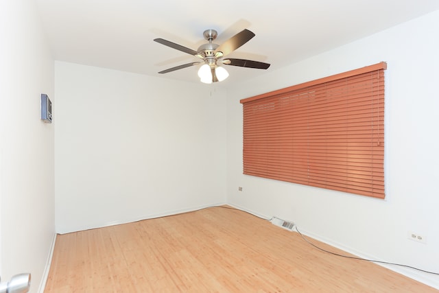 empty room featuring ceiling fan and hardwood / wood-style flooring