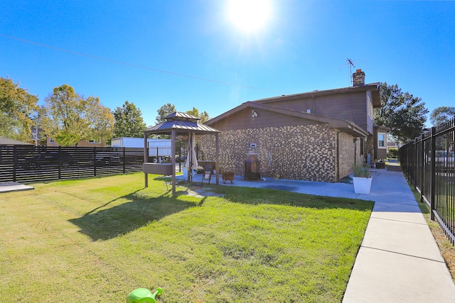 view of yard with a gazebo and a patio area