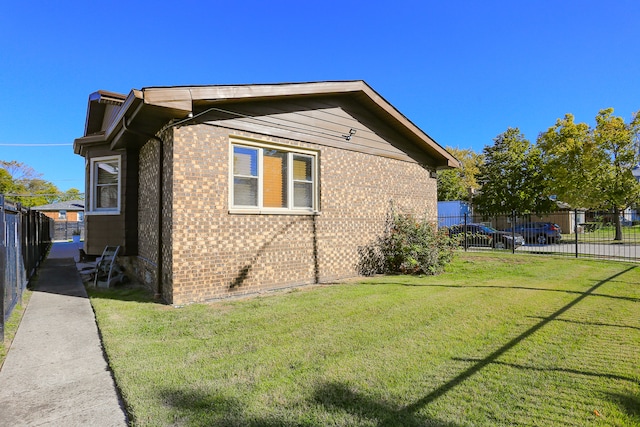 view of home's exterior with a yard