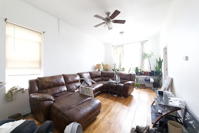 living room with ceiling fan and hardwood / wood-style flooring