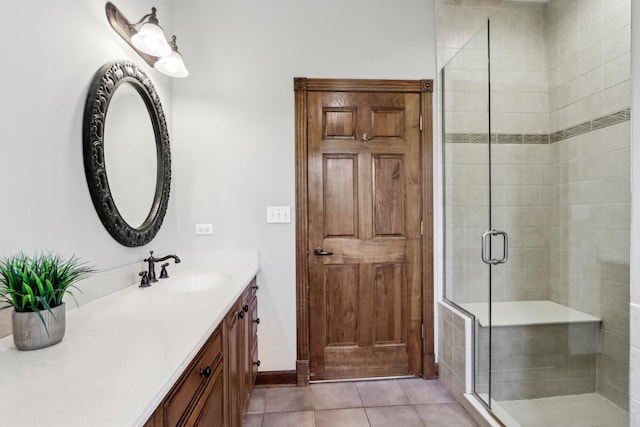 140 E Lynn St, South Elgin, IL 60177 - bathroom with tile patterned floors, baseboards, a shower stall, and vanity
