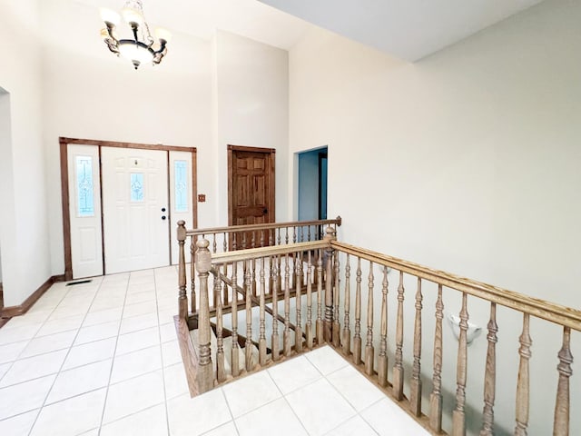 140 E Lynn St, South Elgin, IL 60177 - foyer with baseboards, light tile patterned floors, a notable chandelier, and a towering ceiling