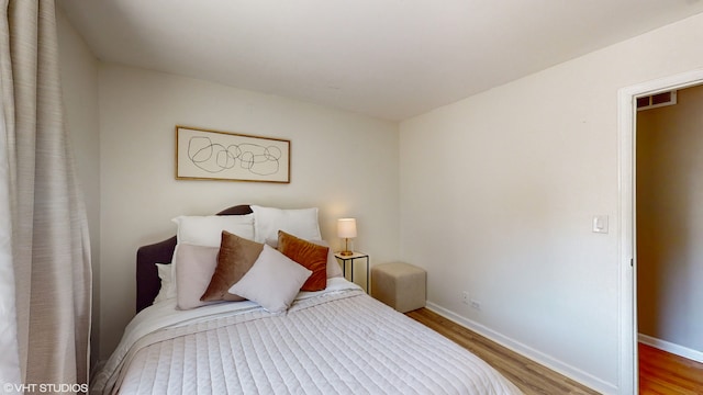 bedroom featuring hardwood / wood-style flooring