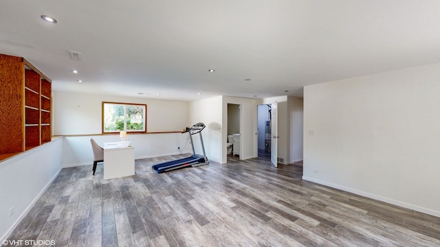 exercise area with wood-type flooring