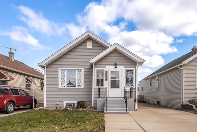 bungalow with a front yard