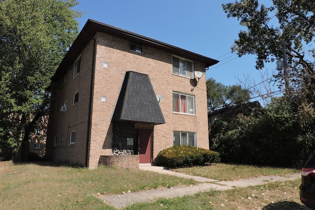 view of home's exterior featuring a yard