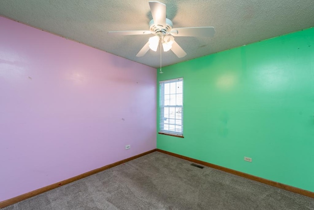 unfurnished room featuring a textured ceiling, carpet floors, and ceiling fan