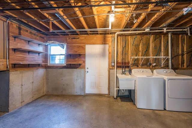 basement with sink and independent washer and dryer