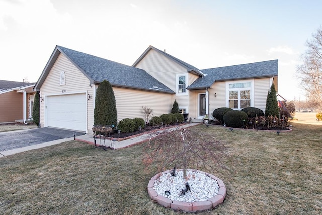 ranch-style home with a garage and a front yard