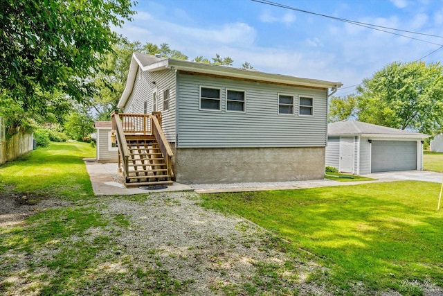 exterior space featuring an outbuilding, a garage, and a front lawn