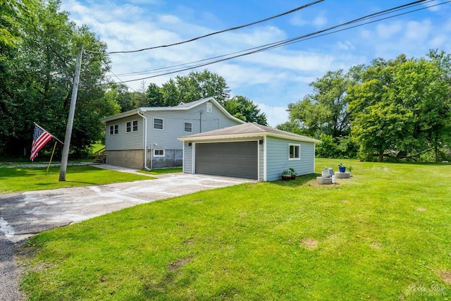 view of home's exterior featuring a lawn and a garage