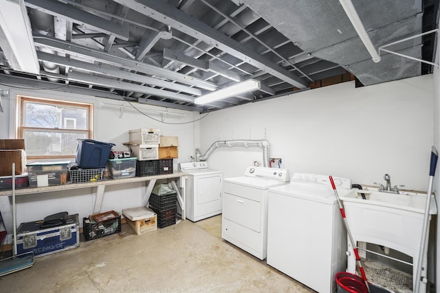 laundry area featuring sink and washing machine and clothes dryer