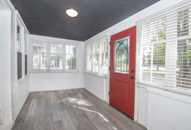 unfurnished sunroom featuring a wealth of natural light