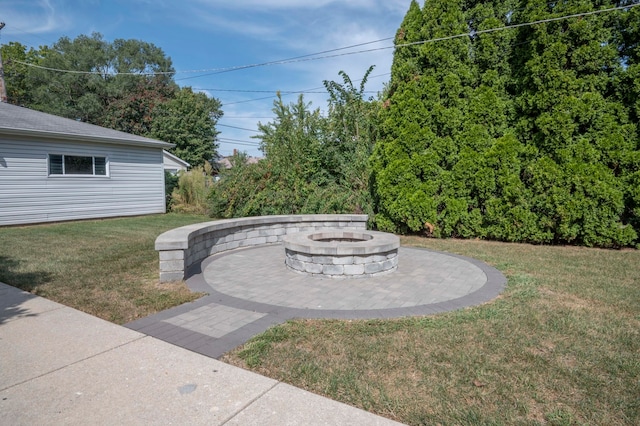 view of yard with a fire pit