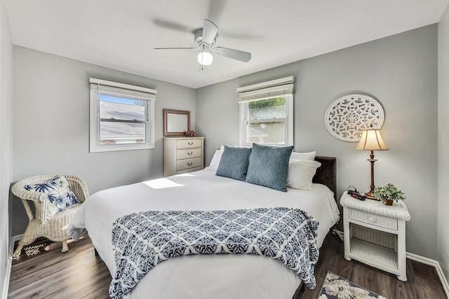 bedroom with dark wood-type flooring and ceiling fan