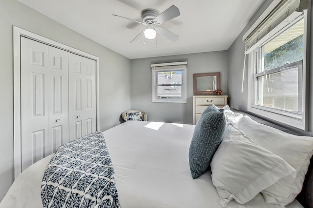 bedroom featuring ceiling fan and a closet