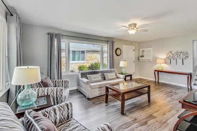 living room with hardwood / wood-style floors and ceiling fan