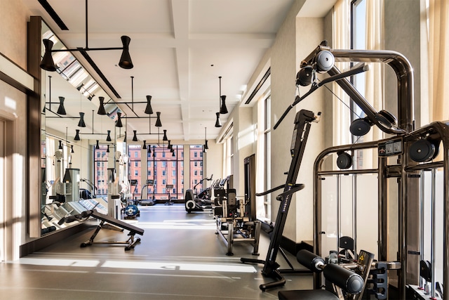 exercise room with coffered ceiling