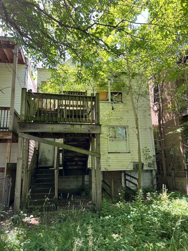 back of property featuring a deck