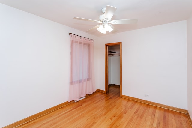 empty room featuring light hardwood / wood-style floors and ceiling fan