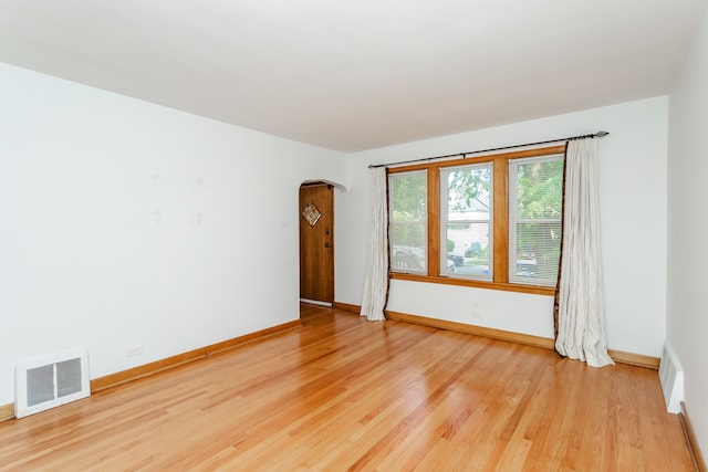 unfurnished room featuring hardwood / wood-style floors