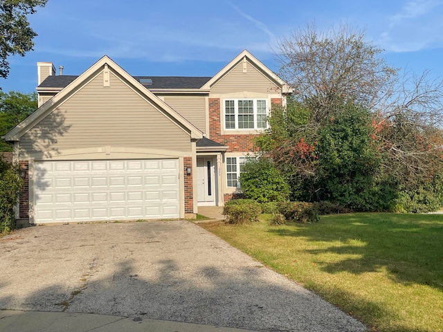 view of front facade featuring a garage and a front yard