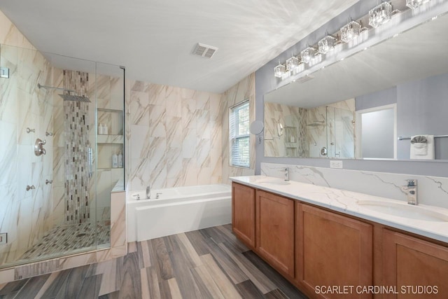 bathroom with vanity, plus walk in shower, and wood-type flooring