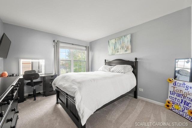 bedroom featuring light carpet