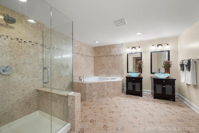 bathroom with shower with separate bathtub and vanity