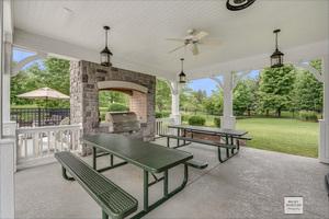 view of patio / terrace featuring area for grilling and ceiling fan