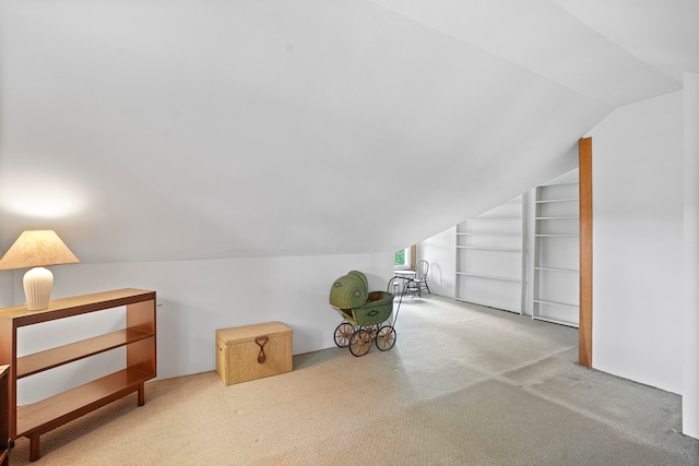 bonus room featuring carpet flooring and lofted ceiling