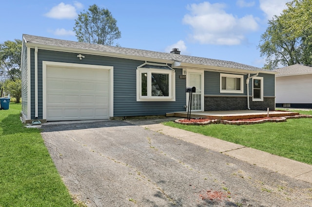 ranch-style home with a front yard and a garage