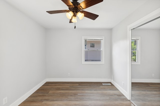 empty room featuring ceiling fan and wood-type flooring