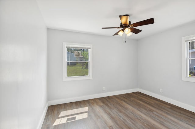 empty room with ceiling fan and wood-type flooring