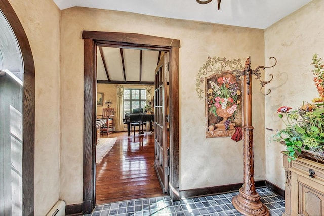 hallway featuring vaulted ceiling and dark hardwood / wood-style flooring