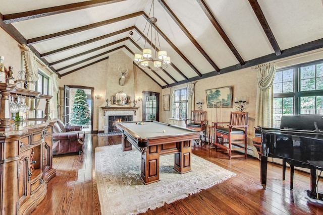 rec room with an inviting chandelier, beam ceiling, hardwood / wood-style flooring, and high vaulted ceiling