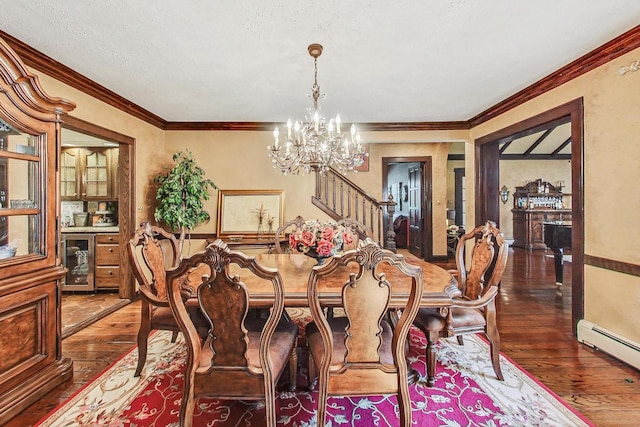 dining space featuring crown molding, dark hardwood / wood-style flooring, a chandelier, and beverage cooler