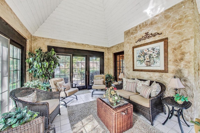 tiled living room with high vaulted ceiling