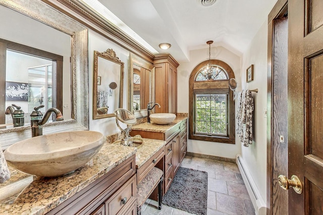 bathroom featuring vanity, vaulted ceiling, a baseboard radiator, and a chandelier